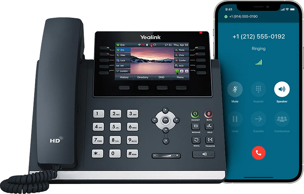 A VoIP desk phone and a smartphone next to each other.