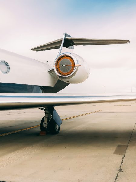 Private luxury jet at the airport terminal runway